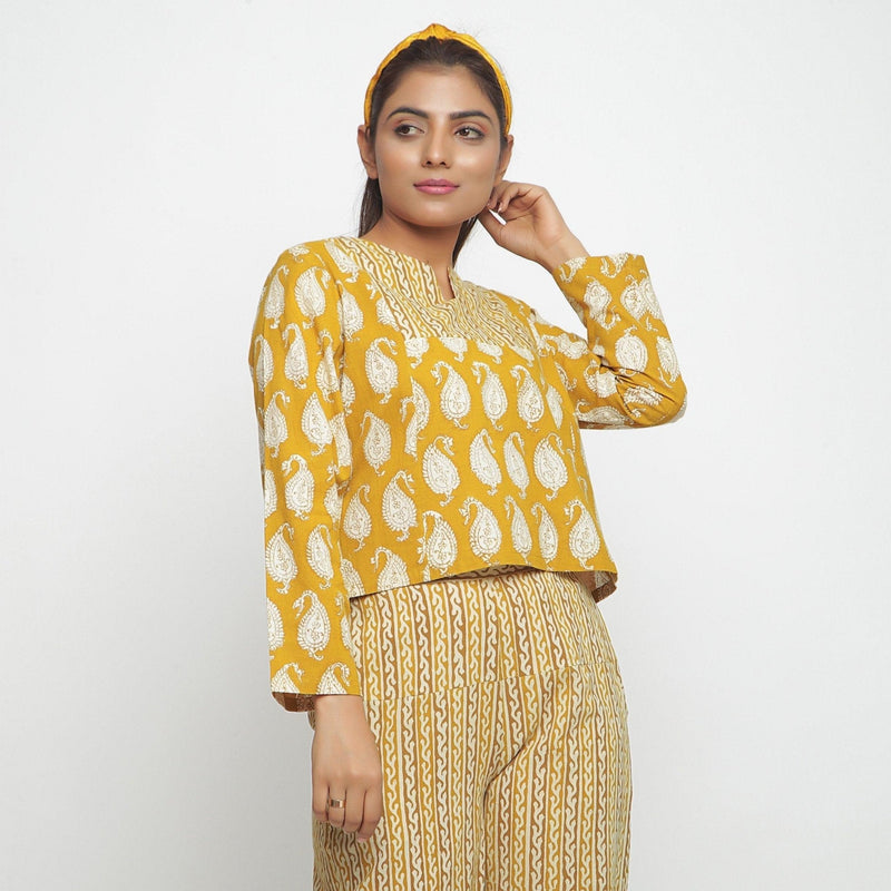 Right View of a Model wearing Mustard Bagru Block Printed High-Low Cotton Top