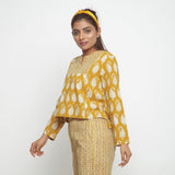 Left View of a Model wearing Bagru Block Print Mustard High Low Top