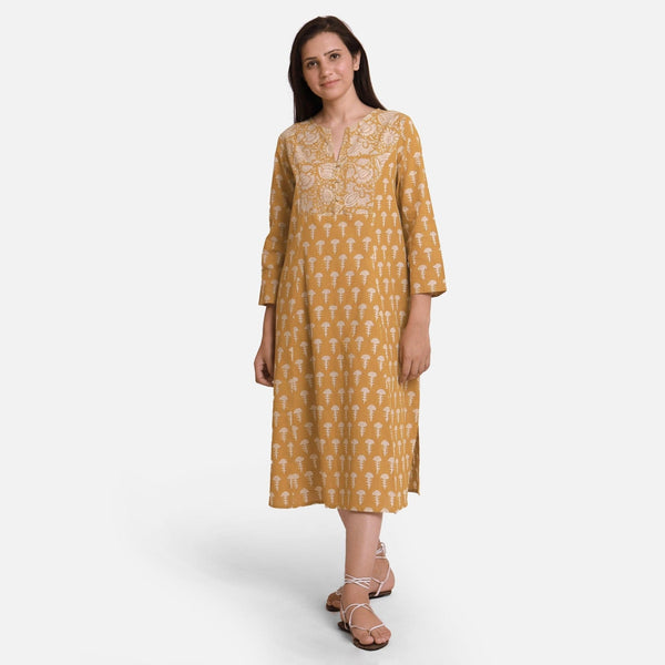 Front View of a Model wearing Mustard Block Print Princess Line Midi Cotton Dress