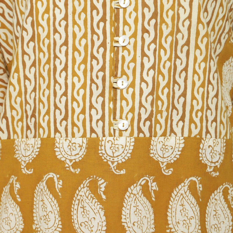 Front Detail of a Model wearing Mustard Block Printed Cotton Ankle Length Snug Dress