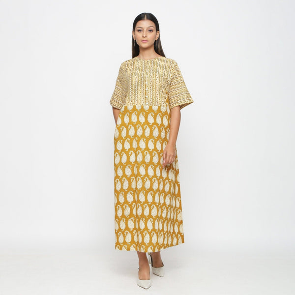 Front View of a Model wearing Mustard Block Printed Cotton Ankle Length Snug Dress