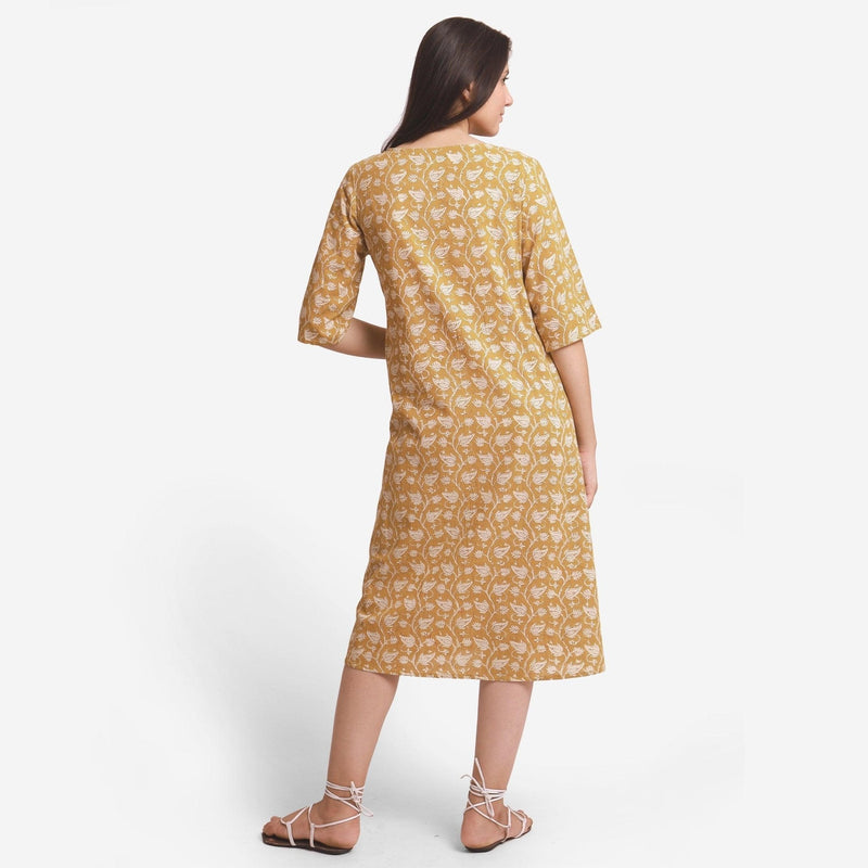 Back View of a Model wearing Bagru Block Print Mustard A-Line Cotton Dress