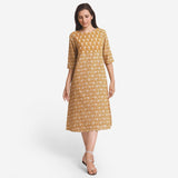 Front View of a Model wearing Bagru Block Print Mustard A-Line Cotton Dress