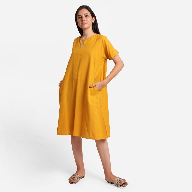 Left View of a Model wearing Mustard Cotton Flax Anti-Fit Dress