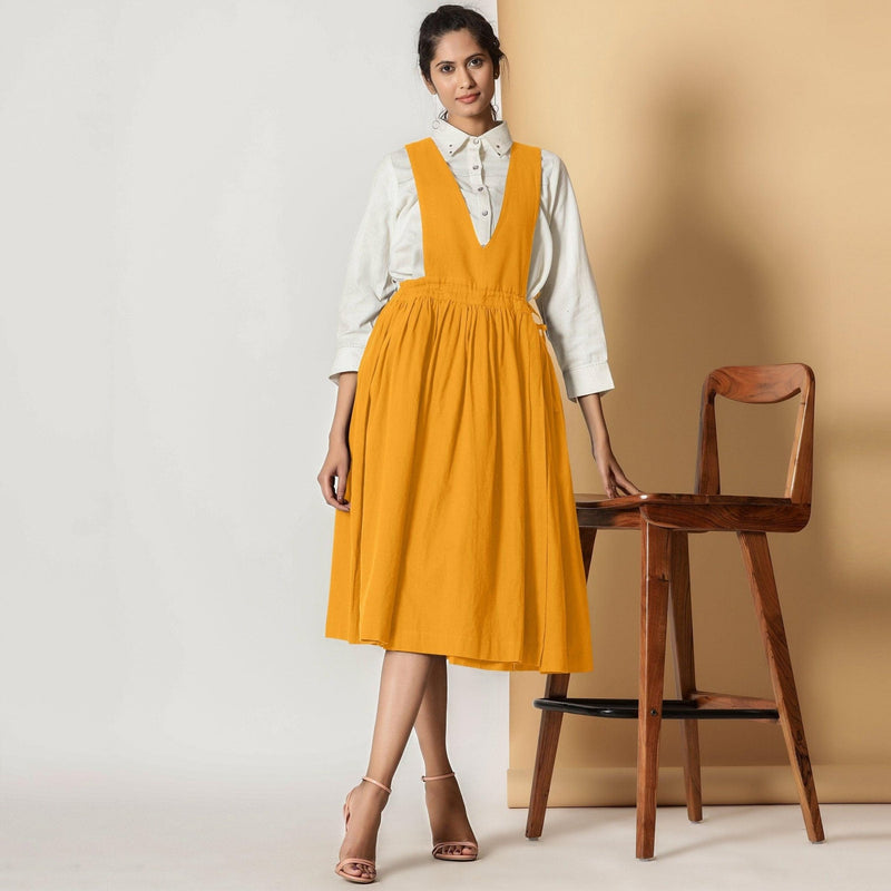 Front View of a Model wearing Mustard Cotton Flax Pinafore Midi Wrap Dress