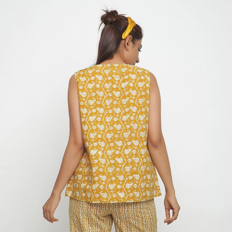 Back View of a Model wearing Mustard Bagru Block Printed Yoked Top