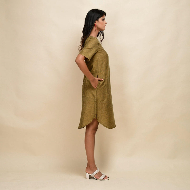 Right View of a Model wearing Mustard Gold 100% Cotton Knee Length Dress