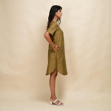 Right View of a Model wearing Mustard Gold 100% Cotton Khadi Knee Length Dress