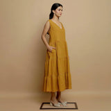 Right View of a Model wearing Mustard V-Neck Handwoven Tier Dress