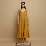 Front View of a Model wearing Mustard V-Neck Handwoven Tier Dress