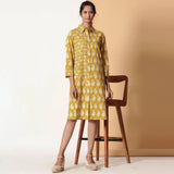 Front View of a Model wearing Mustard Paisley Bagru Block Printed Shirt Dress