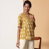 Right View of a Model wearing Mustard Bagru Block Printed Pocket Top