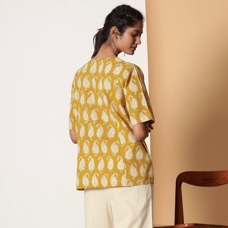 Back View of a Model wearing Mustard Bagru Block Printed Pocket Top