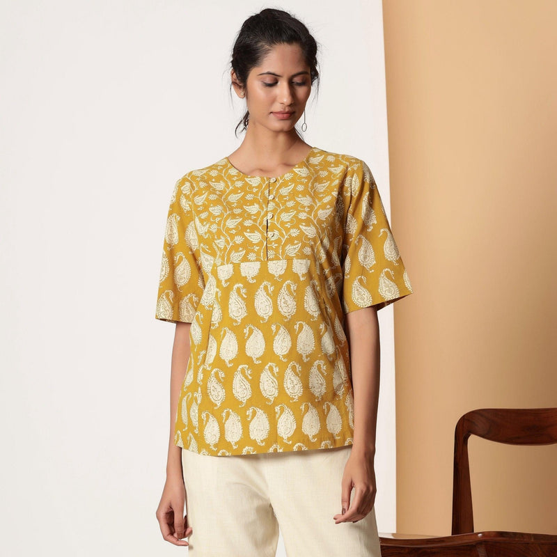 Front View of a Model wearing Mustard Bagru Block Printed Pocket Top