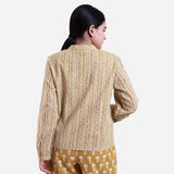 Back View of a Model wearing Mustard Striped Block Print Cotton Mandarin Collar Top