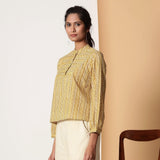 Left View of a Model wearing Mustard Striped Bagru Block Print Yoked Shirt