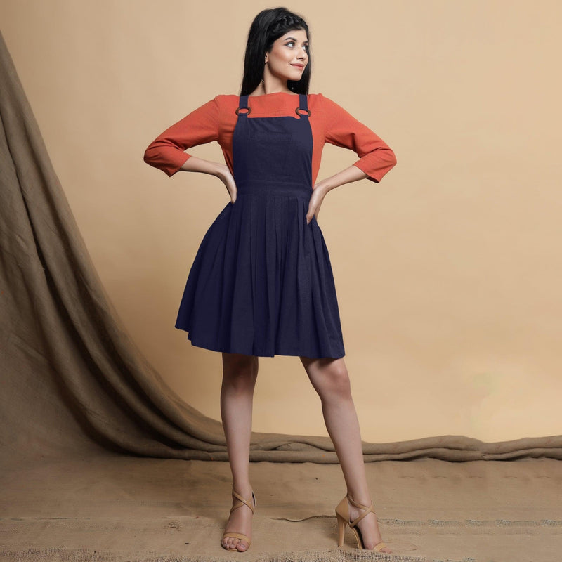 Front View of a Model wearing Navy Blue Cotton Flax Knee Length Criss-Cross Back Dress