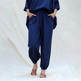 Front View of a Model wearing Navy Blue Cotton Flax High-Rise Elasticated Jogger Pant