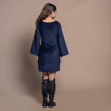 Back View of a Model wearing Navy Blue Cotton Velvet Boat Neck Sheath Short Dress