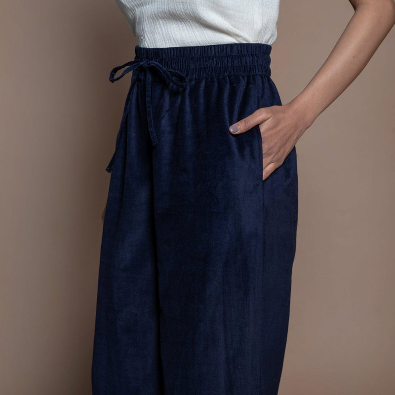 Left Detail of a Model wearing Navy Blue Cotton Velvet Elasticated High-Rise Pant