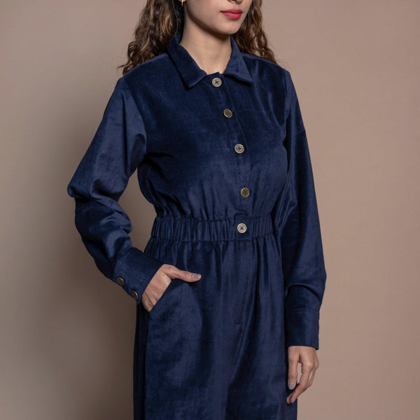 Front Detail of a Model wearing Navy Blue Cotton Velvet Bootcut Jumpsuit