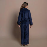 Back View of a Model wearing Navy Blue Velvet Pant and Bomber Jacket Set