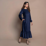 Right View of a Model wearing Navy Blue Cotton Velvet Tier Maxi Dress