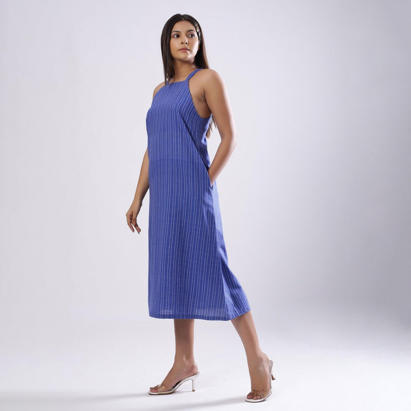 Left View of a Model wearing Navy Blue Handspun Slit Slip Dress