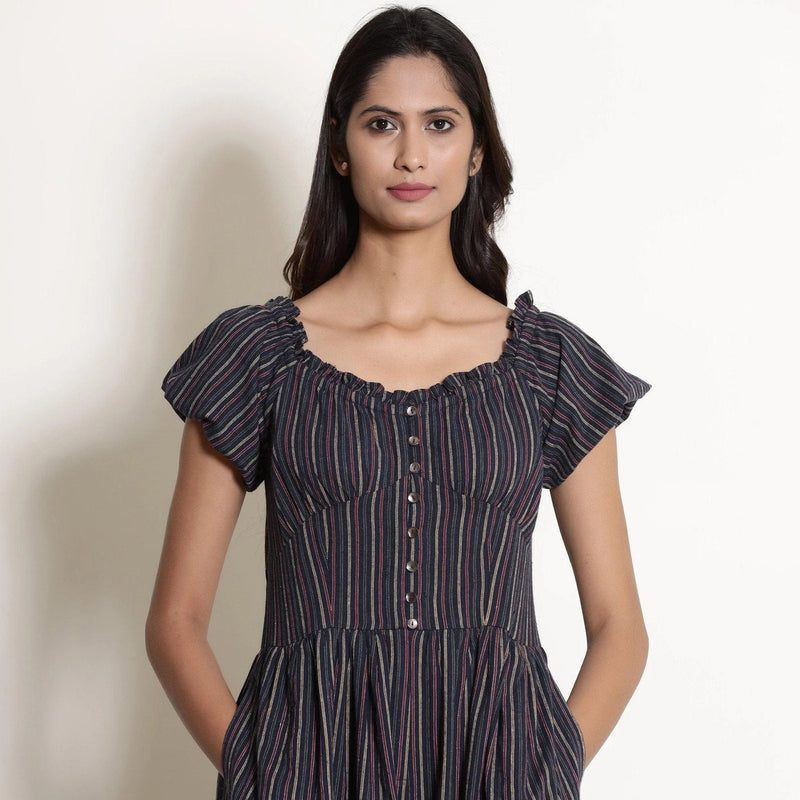 Front View of a Model wearing Navy Blue Striped Frilled Neck Flared Jumpsuit