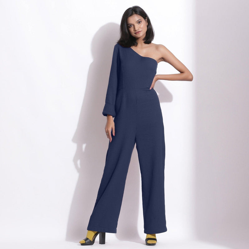 Front View of a Model wearing Navy Blue Honeycomb One-Shoulder Jumpsuit