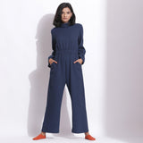 Front View of a Model wearing Navy Blue Cotton Waffle Turtle Neck Overalls