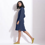 Left View of a Model wearing Navy Blue Cotton Waffle Turtleneck Dress