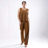 Front View of a Model wearing Handspun Oak Brown Straight Cotton Top