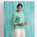 Right View of a Model wearing Ocean Green Handspun 100% Cotton Mirror Work Blouse Top