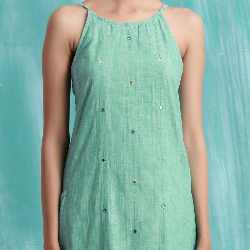 Front Detail of a Model wearing Ocean Green Handspun Cotton Criss-Cross A-Line Short Dress