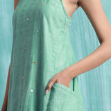 Front Detail of a Model wearing Ocean Green Handspun 100% Cotton A-Line Dress