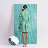 Back View of a Model wearing Ocean Green Handspun Cotton V-Neck Gathered Short Dress