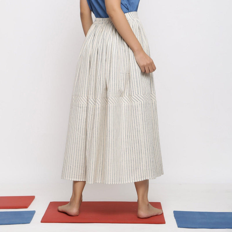 Back View of a Model wearing Vegetable Dyed Off-White Gathered Skirt