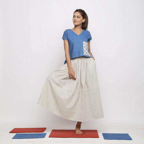 Front View of a Model wearing Off-White and Blue Striped Yarn Dyed Cotton Gathered Maxi Skirt