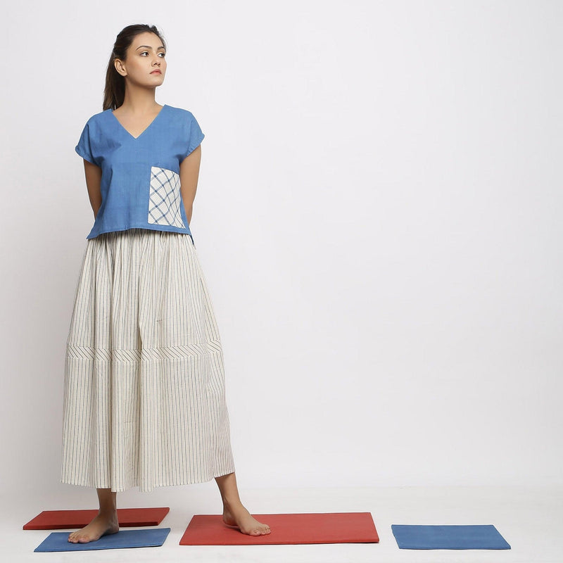 Front View of a Model wearing Vegetable Dyed Off-White Gathered Skirt