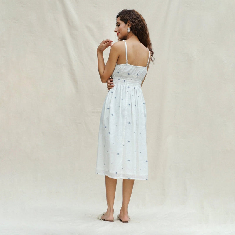 Left View of a Model wearing Off-White Aztec Handspun Cotton Jamdani Midi Slip Dress