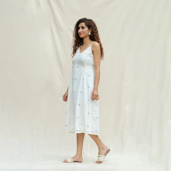 Left View of a Model wearing Off-White Aztec Handspun Cotton Jamdani Midi Slip Dress