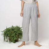 Front View of a Model wearing Off-White Checkered Cotton Muslin Elasticated Mid-Rise Pant