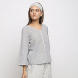 Right View of a Model wearing Off-White Handwoven Cotton V-Neck Top