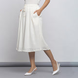 Left View of a Model wearing Off-White Crinkled Cotton Flared Skirt