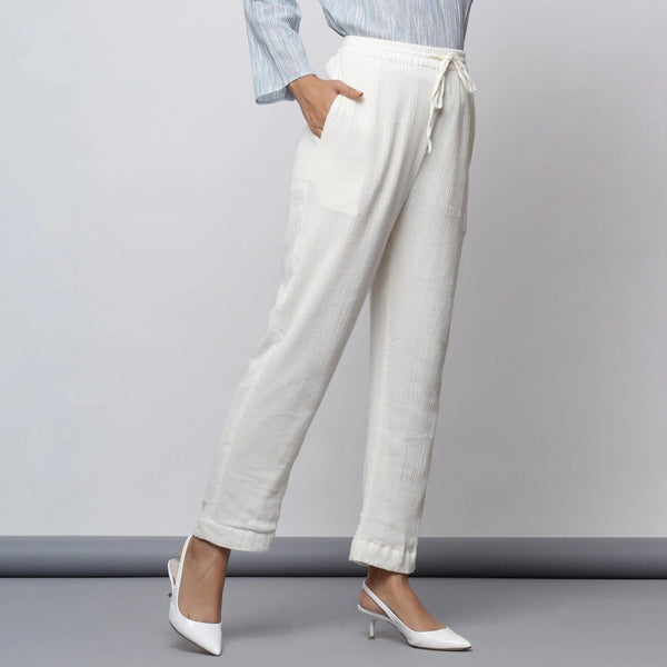 Right View of a Model wearing Off-White Crinkled Cotton Tapered Pant