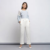 Front View of a Model wearing Off-White Crinkled Cotton Tapered Pant