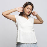 Right View of a Model wearing Off-White Crinkled Cotton Wrap Top