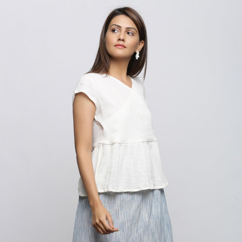 Right View of a Model wearing Off-White Crinkled Cotton Wrap Top