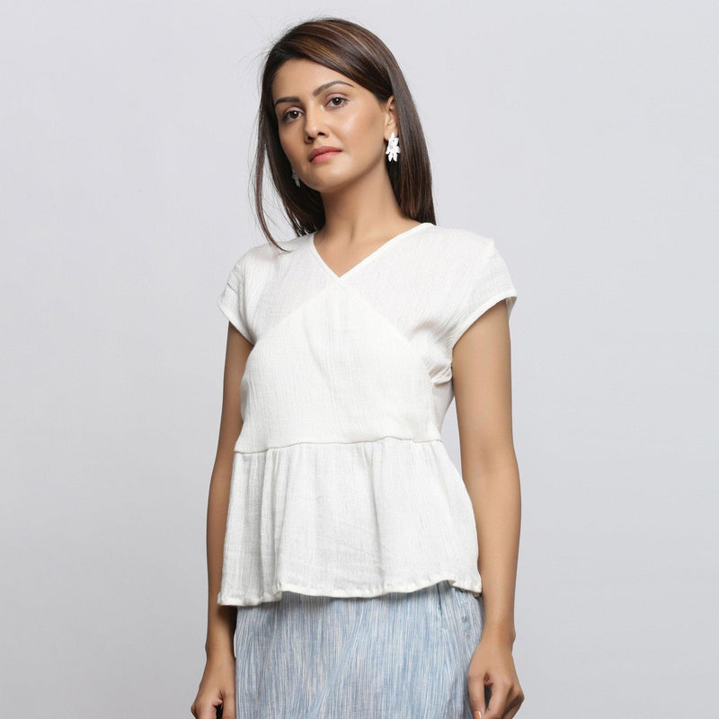 Front View of a Model wearing Off-White Crinkled Cotton Wrap Top